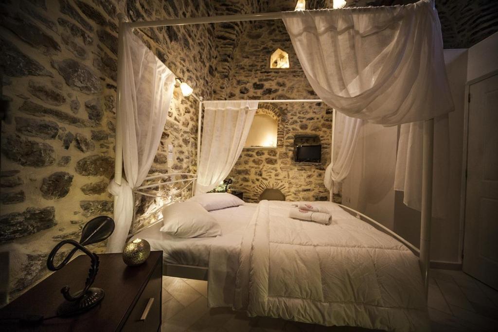Säng eller sängar i ett rum på Vilitsa Holiday House