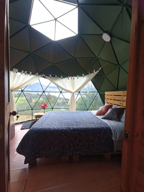 Voodi või voodid majutusasutuse Glamping El Refugio toas