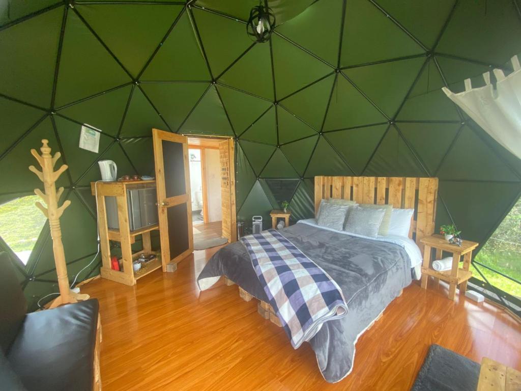Voodi või voodid majutusasutuse Glamping El Refugio toas