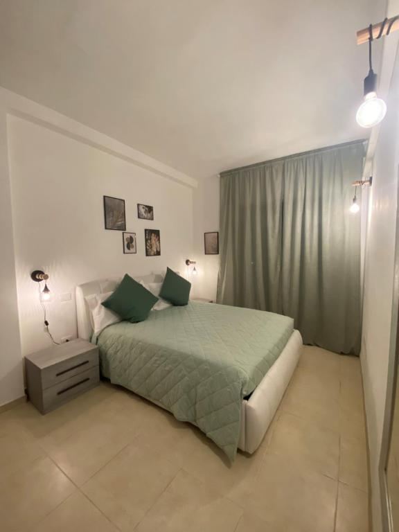 Кровать или кровати в номере Civico 107