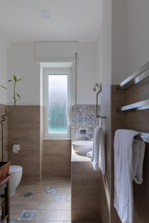 A bed or beds in a room at Appartamento con terrazza vicino al Vaticano