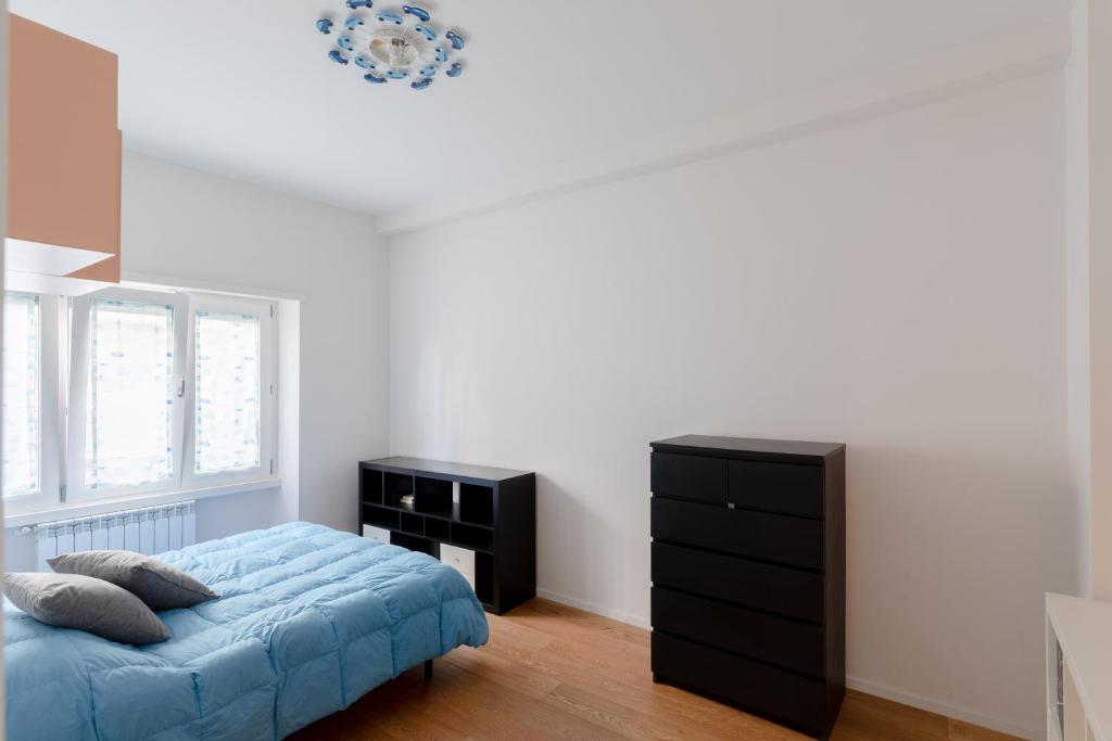 Łóżko lub łóżka w pokoju w obiekcie Stupendo appartamento in quartiere residenziale