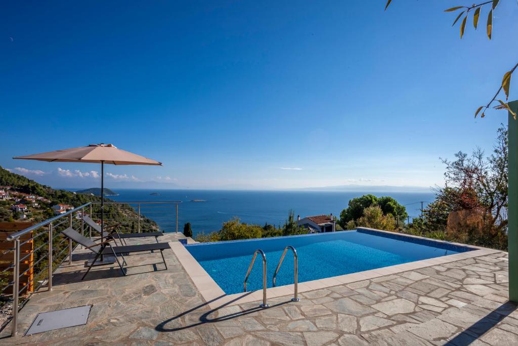 a villa with a pool and a view at Olea Skopelos villas with swimming pools & sea view in Panormos Skopelos