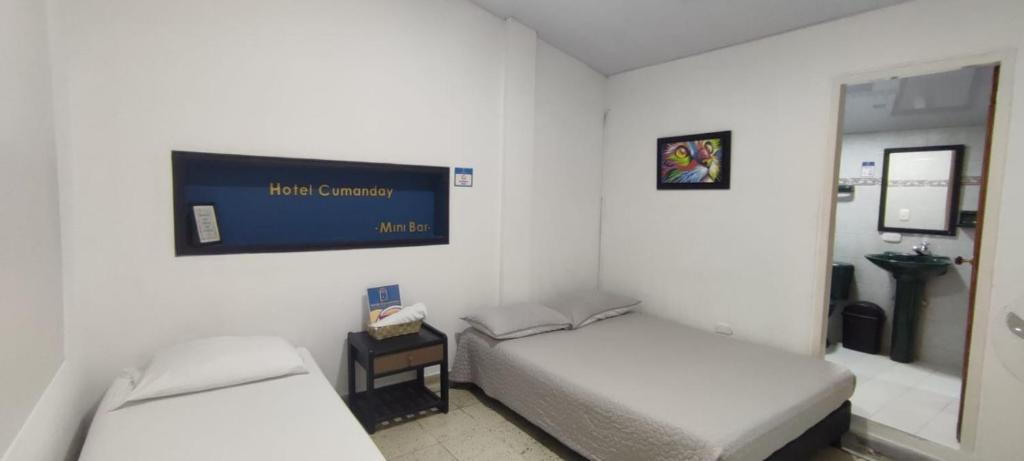 Postel nebo postele na pokoji v ubytování HOTEL CUMANDAY