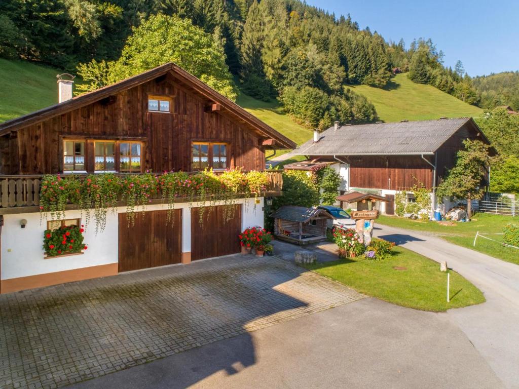 an aerial view of a house with a driveway at Monteschiel in Bürserberg