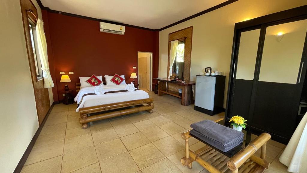 Postel nebo postele na pokoji v ubytování Garden Resort