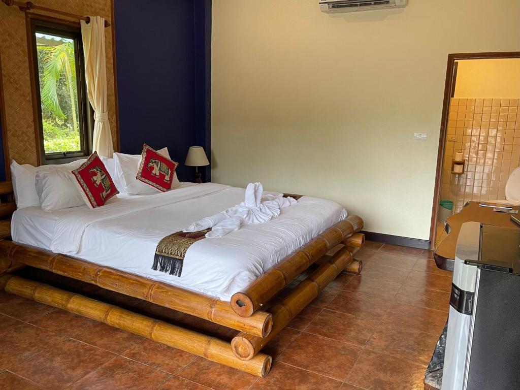 Postel nebo postele na pokoji v ubytování Garden Resort