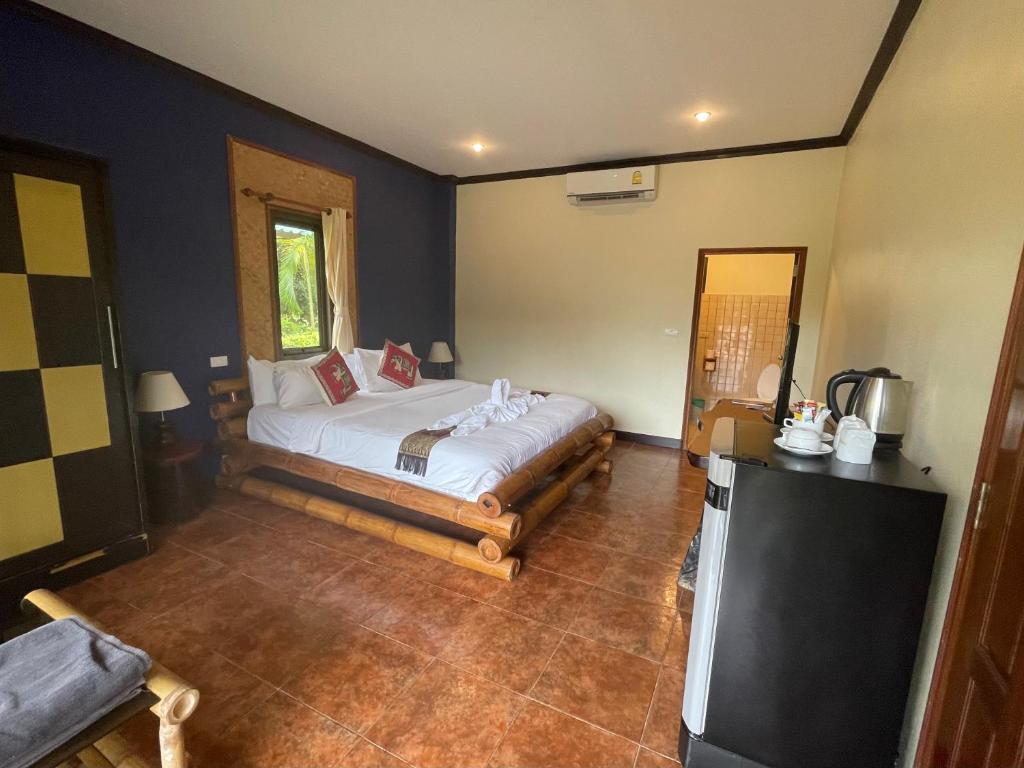 Postel nebo postele na pokoji v ubytování Garden Resort