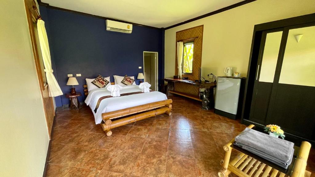 Postel nebo postele na pokoji v ubytování Garden Resort