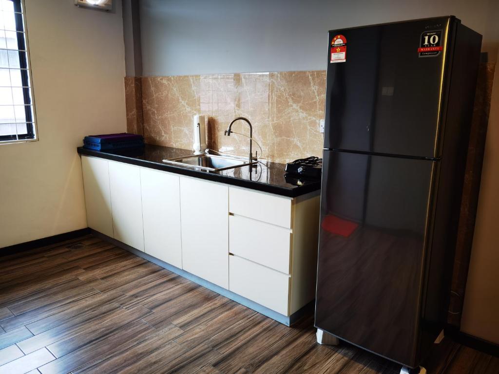 Kuchyň nebo kuchyňský kout v ubytování 3-Plus Hotel