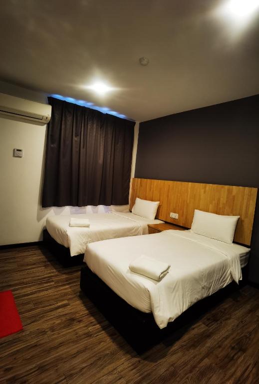 Postel nebo postele na pokoji v ubytování 3-Plus Hotel