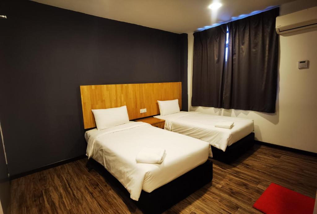 Postel nebo postele na pokoji v ubytování 3-Plus Hotel