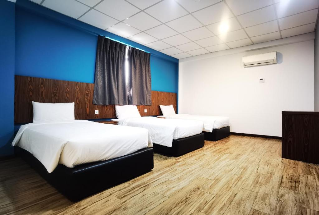 Postel nebo postele na pokoji v ubytování 3-Plus Hotel