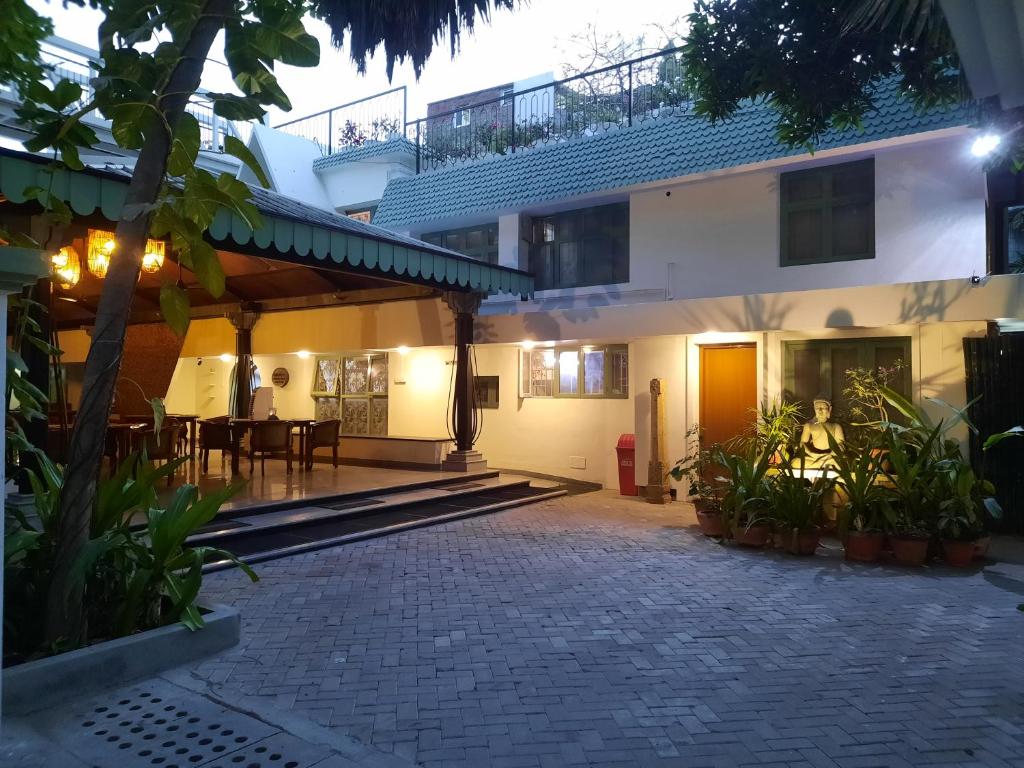 a view of the courtyard of a house at night at Hanu Reddy Residences Poes Garden in Chennai