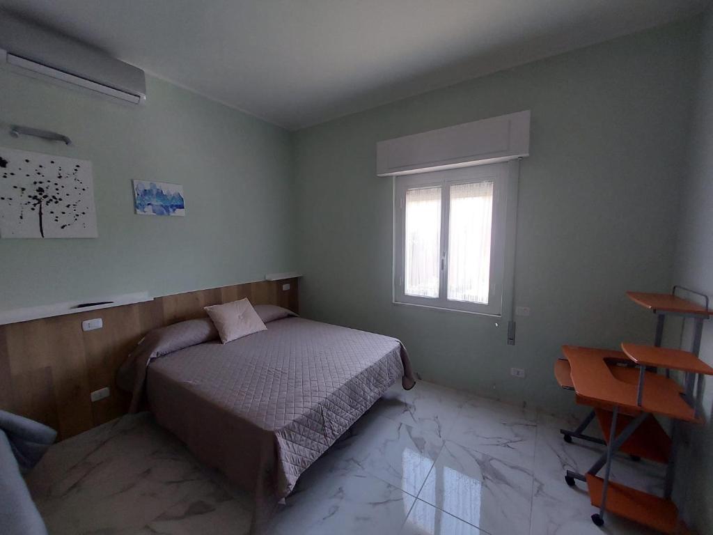 Posteľ alebo postele v izbe v ubytovaní EL MAR casa vacanza Lavinio mare