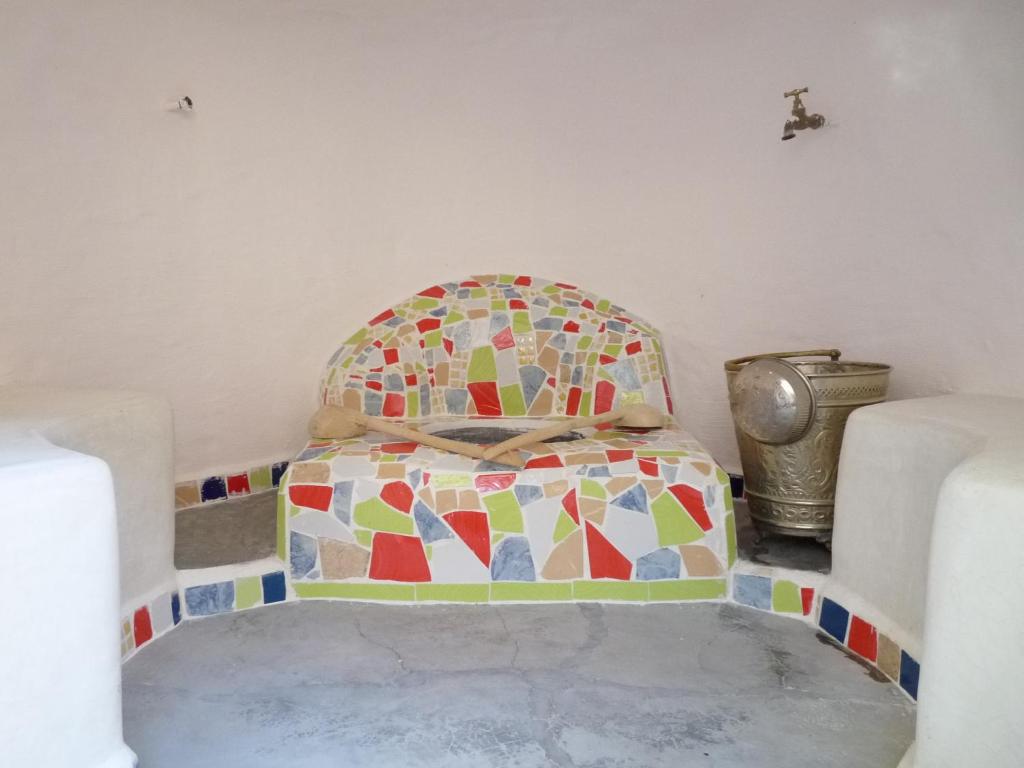 Postel nebo postele na pokoji v ubytování Kasbah Timdaf