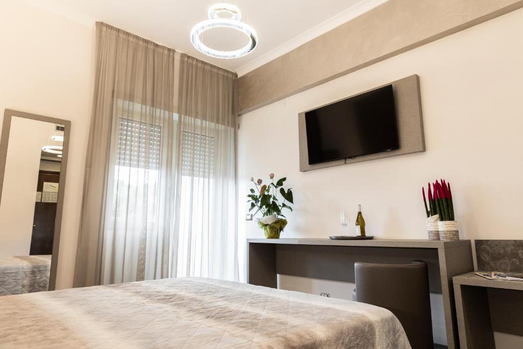 Postel nebo postele na pokoji v ubytování Hotel Casa Tra Noi