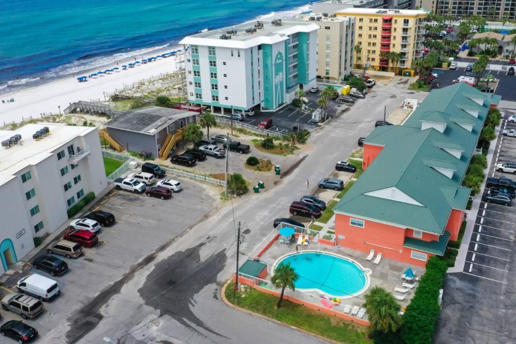 an aerial view of a city with a beach and buildings at Tropical Isle #112 in Fort Walton Beach