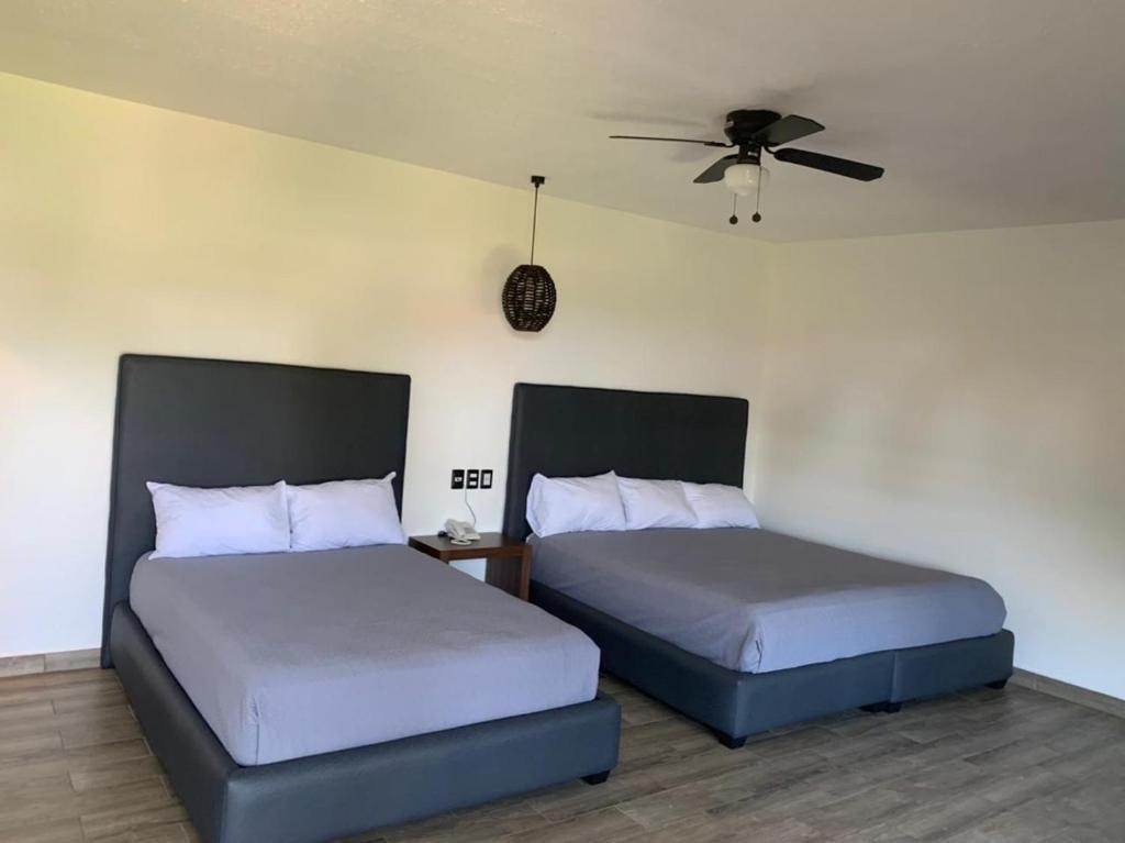 Postel nebo postele na pokoji v ubytování Mar De Estrellas - Hotel