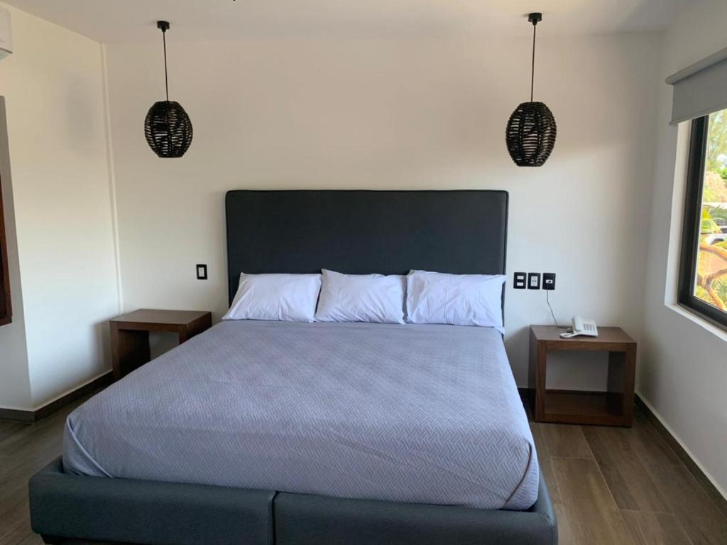 Postel nebo postele na pokoji v ubytování Mar De Estrellas - Hotel