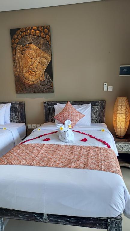 Kubu Garden Suites & Villas Nusa Dua房間的床