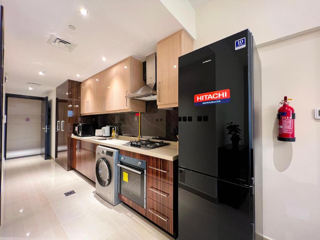 Kuchyň nebo kuchyňský kout v ubytování Luton Vacation Homes - Elite Residence Downtown, Dubai