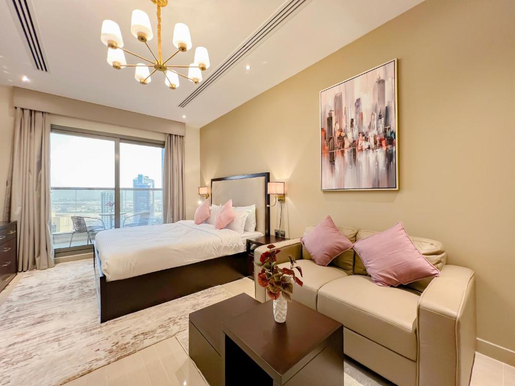 Postel nebo postele na pokoji v ubytování Luton Vacation Homes - Elite Residence Downtown, Dubai