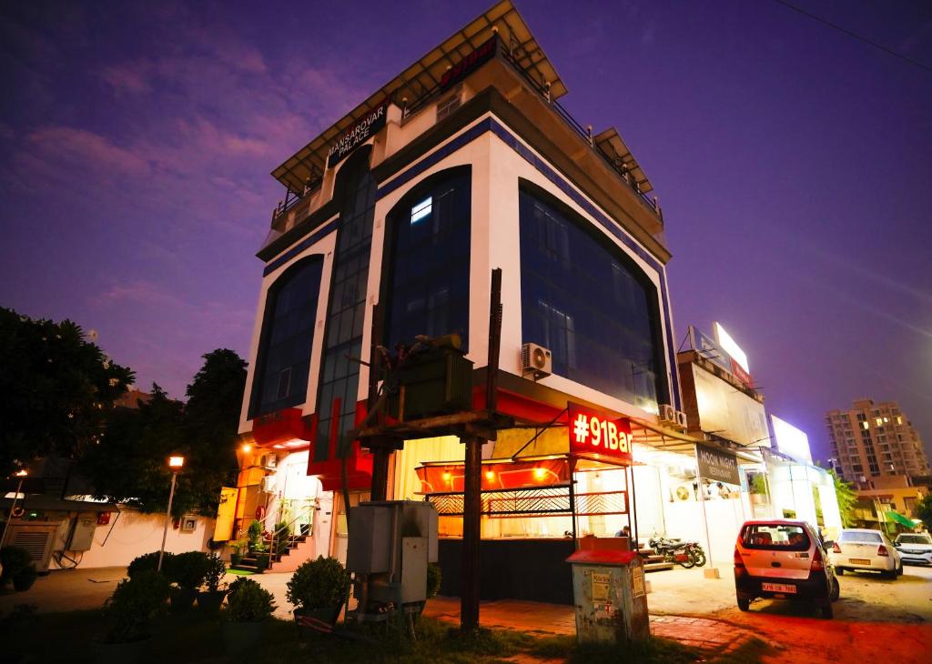 a building with a sign on the side of it at Hotel Mansarovar Palace in Jaipur