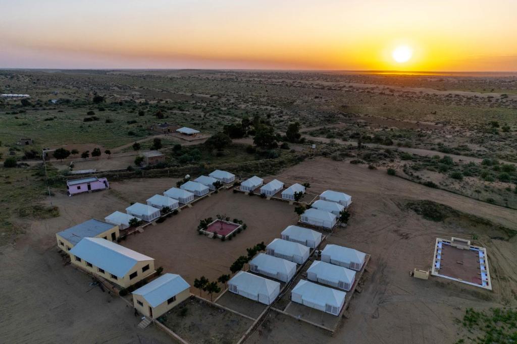 an aerial view of a group of tents in the desert at Rajwada Desert Camp in Jaisalmer