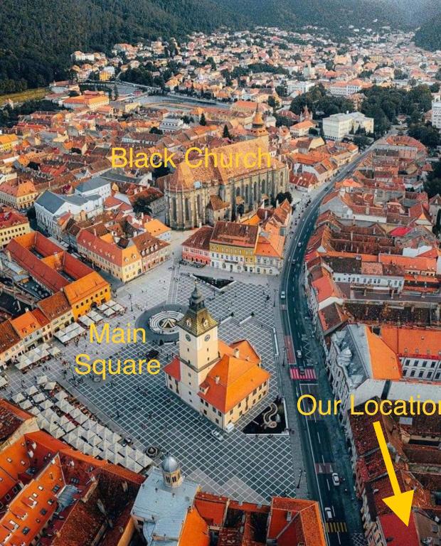 an aerial view of a city with buildings at Brassai Square in Braşov
