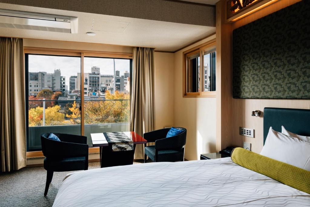 Postel nebo postele na pokoji v ubytování Hotel Alza Kyoto