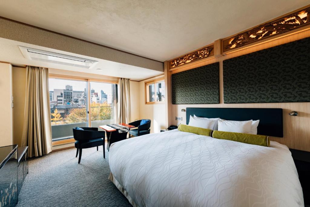 Postel nebo postele na pokoji v ubytování Hotel Alza Kyoto
