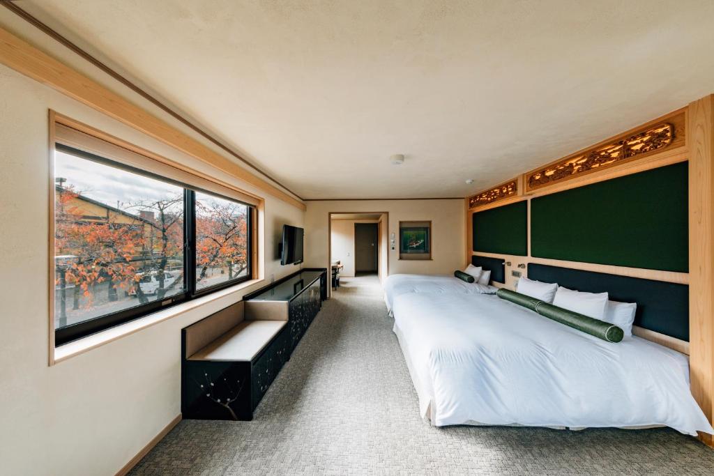 Postel nebo postele na pokoji v ubytování Hotel Alza Kyoto