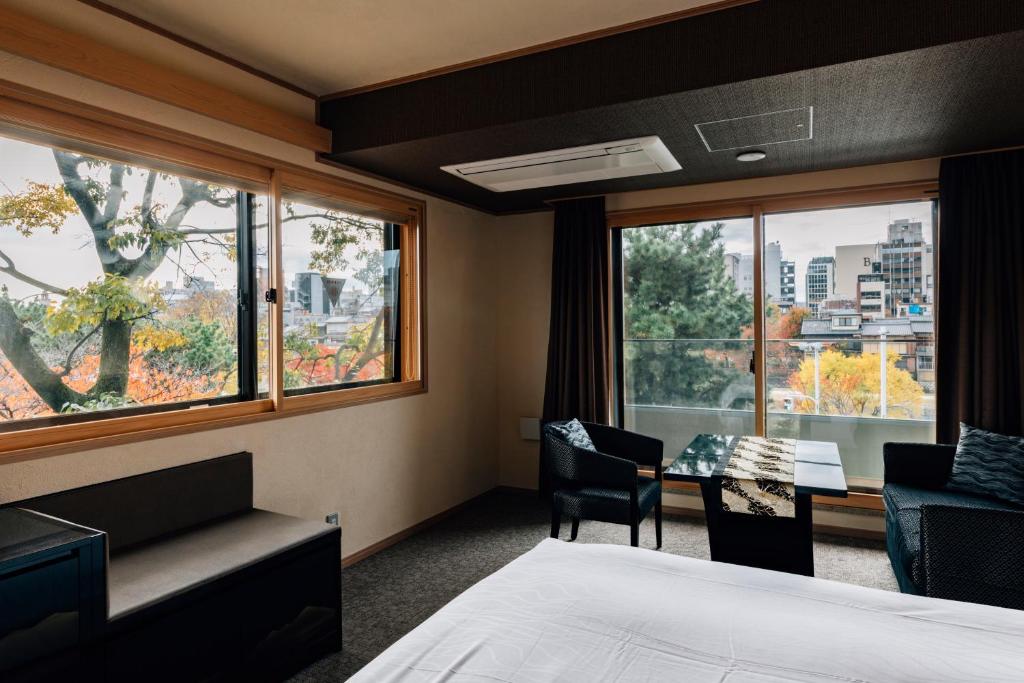 Postel nebo postele na pokoji v ubytování Hotel Alza Kyoto