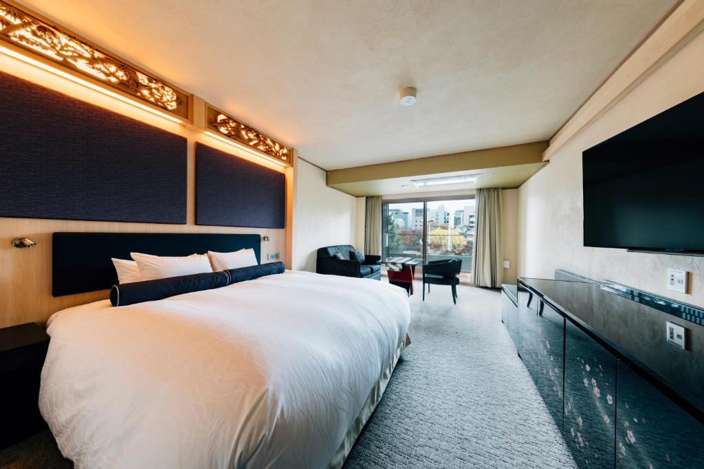 Postel nebo postele na pokoji v ubytování Hotel Alza Kyoto