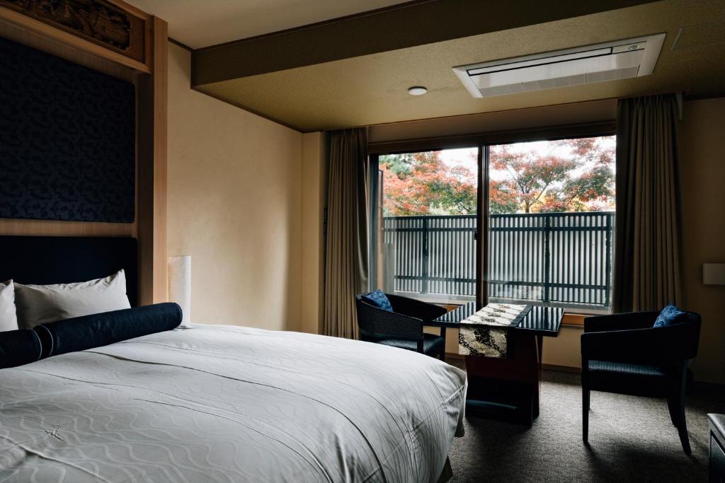 Postel nebo postele na pokoji v ubytování Hotel Alza Kyoto