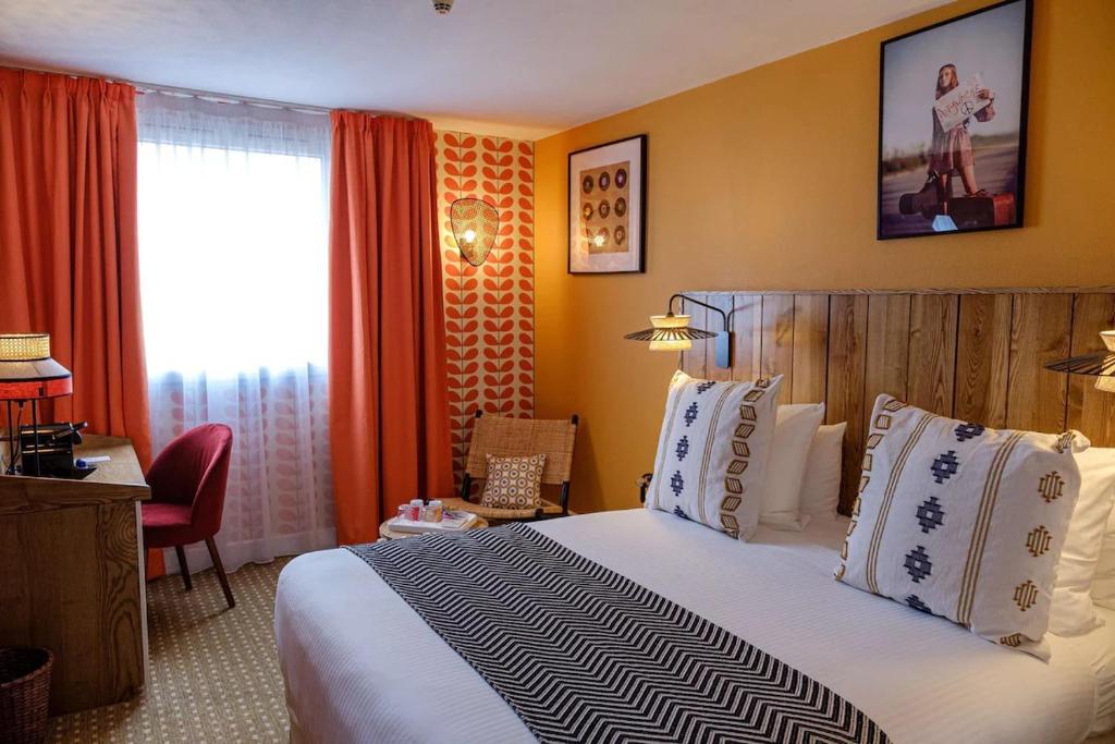 a hotel room with a large bed and a window at Aiden by Best Western at Paris Roissy CDG in Roissy-en-France