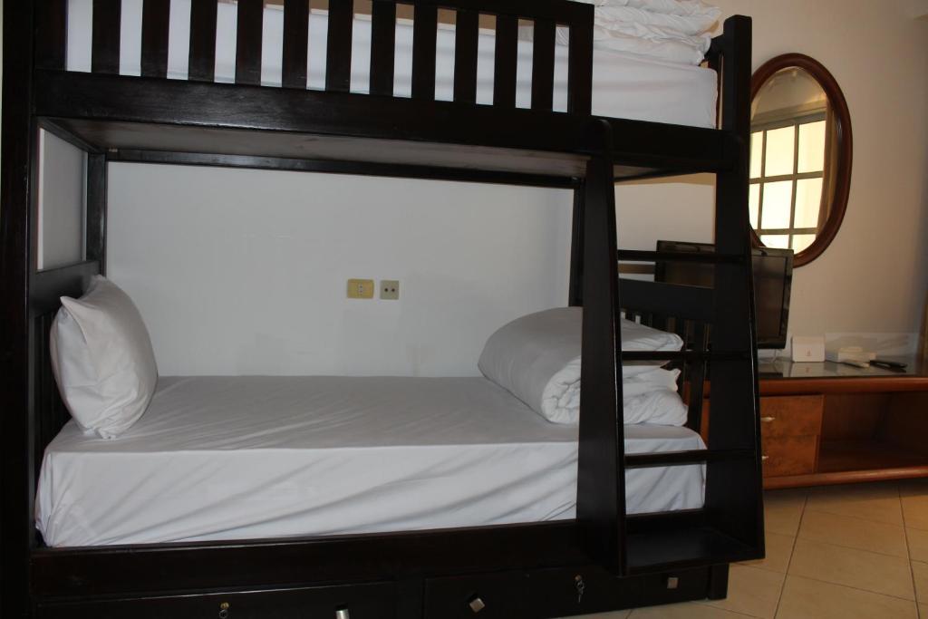 Postel nebo postele na pokoji v ubytování Herrmes Hostel
