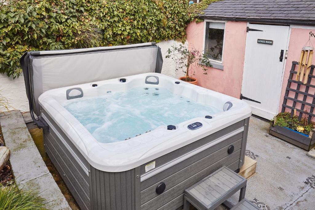 a large jacuzzi tub sitting in a yard at Host & Stay - Seagull Cottage in Bridlington