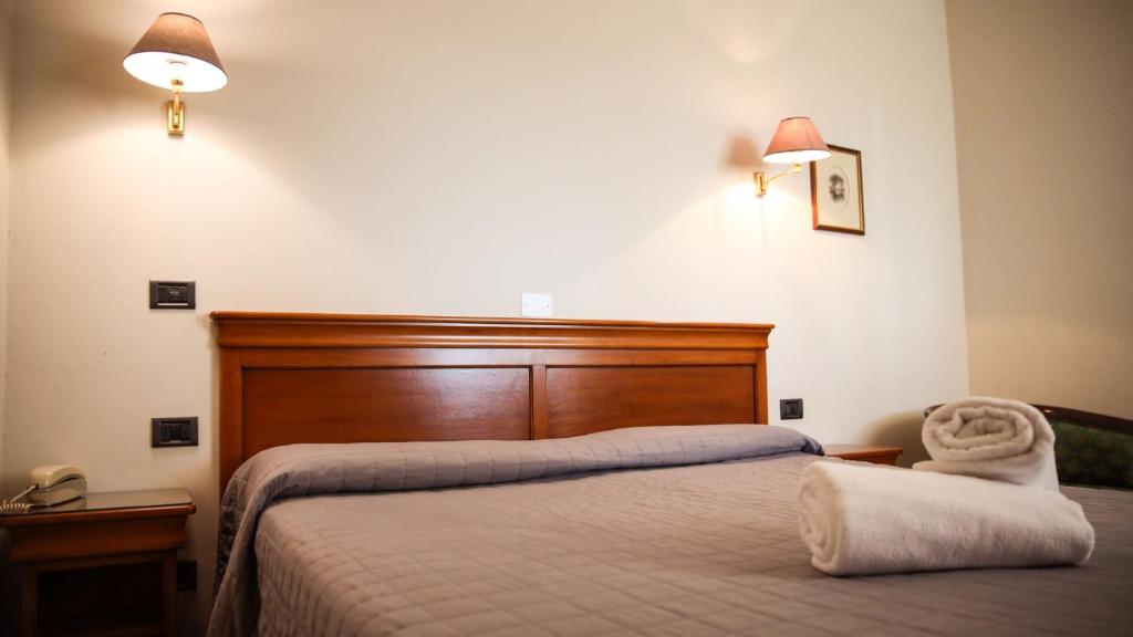 Postel nebo postele na pokoji v ubytování Bagno Santo Residence