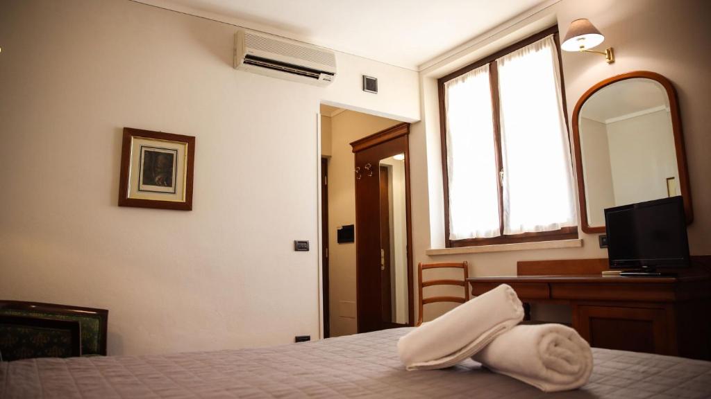 Postel nebo postele na pokoji v ubytování Bagno Santo Residence