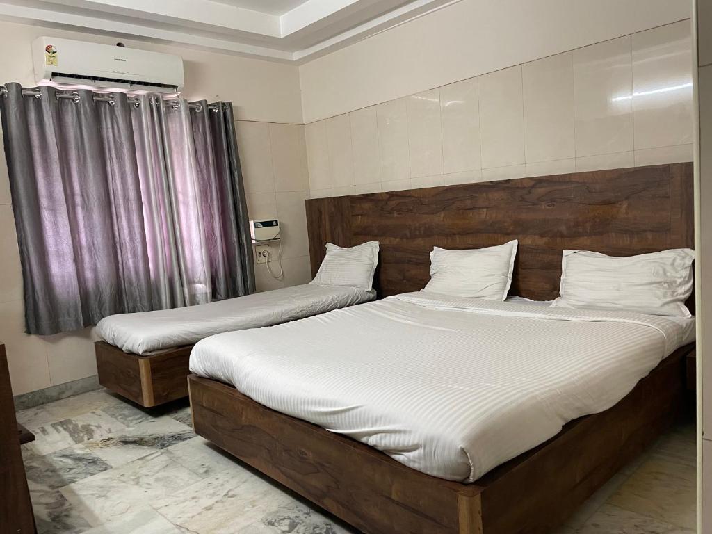 Postel nebo postele na pokoji v ubytování Hotel Joyce