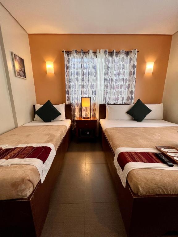 Postel nebo postele na pokoji v ubytování Casa Coron Hotel