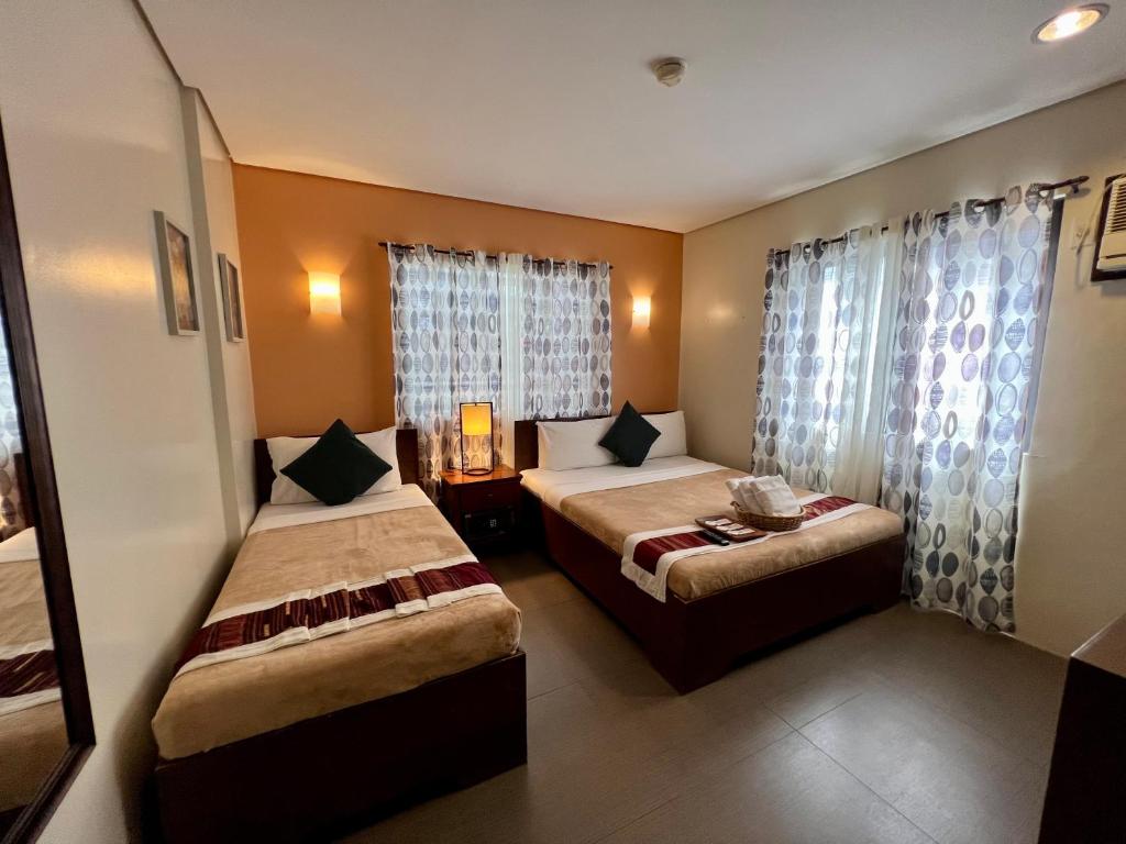 Postel nebo postele na pokoji v ubytování Casa Coron Hotel