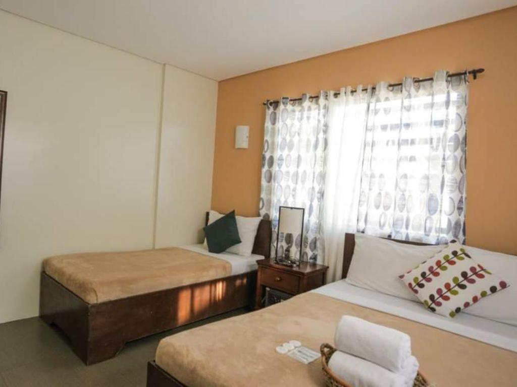 Postel nebo postele na pokoji v ubytování Casa Coron Hotel