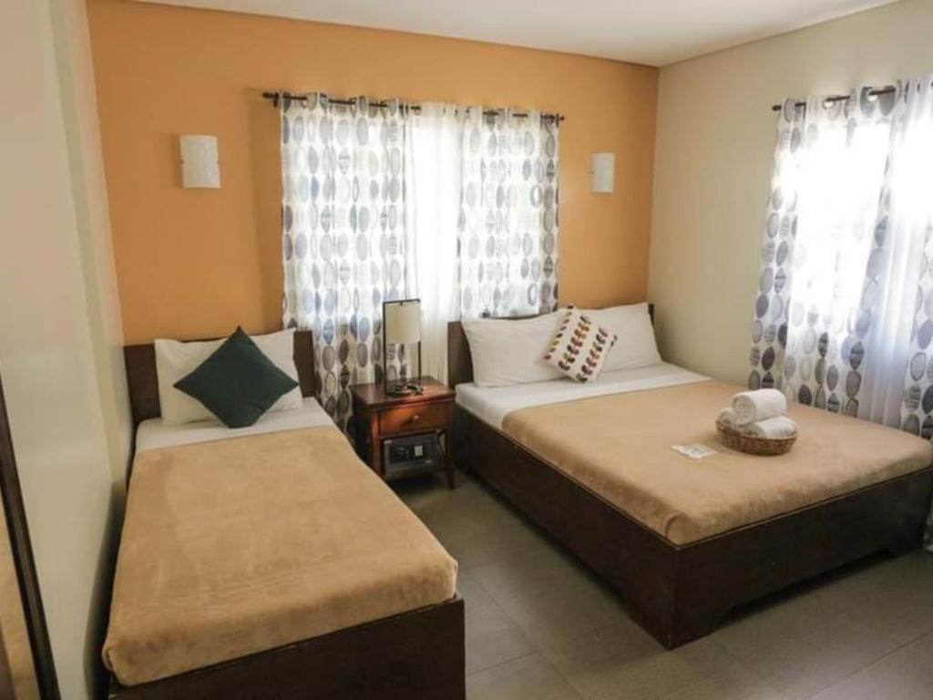 Postel nebo postele na pokoji v ubytování Casa Coron Hotel