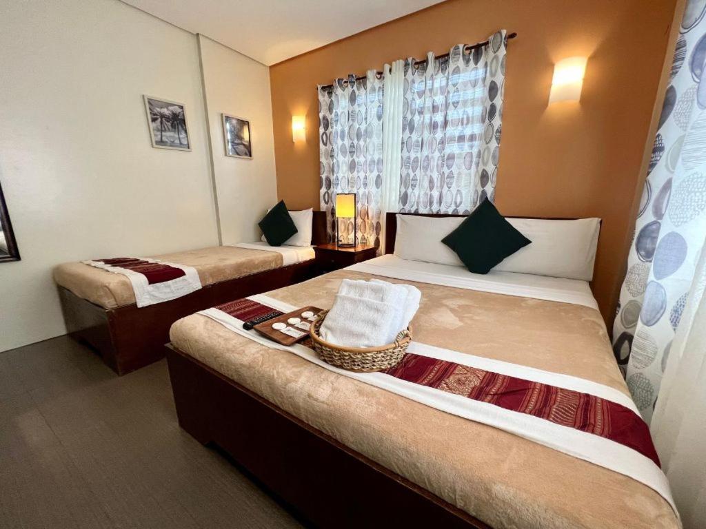 Postel nebo postele na pokoji v ubytování Casa Coron Hotel