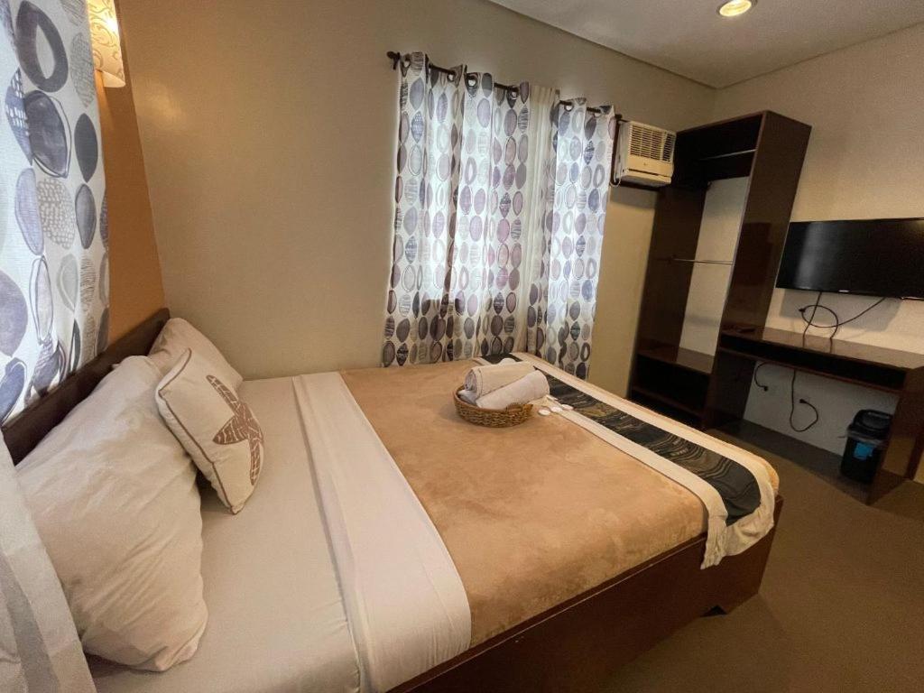 Postel nebo postele na pokoji v ubytování Casa Coron Hotel