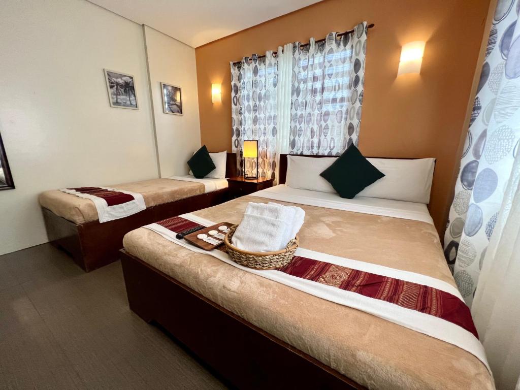 Postel nebo postele na pokoji v ubytování Casa Coron Hotel