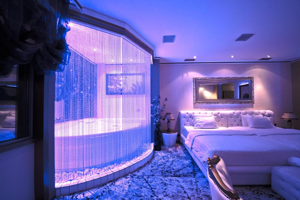 Llit o llits en una habitació de Hotel Rosa Blu